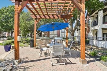 Two outdoor dining & grilling areas